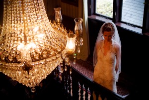 Bride on Gramercy Staircase Balcony lit by the light of the Chandelier (Freundel) ++++