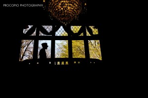 Groom on balcony, Procopio Photography