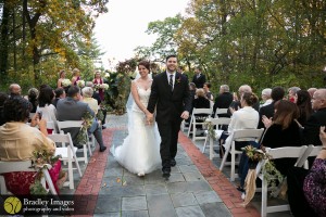 Bride and groom following garden ceremony, Bradley Images