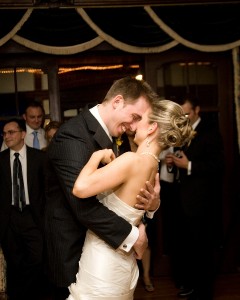 Bride and Groom Caressing One Another at Wedding Reception