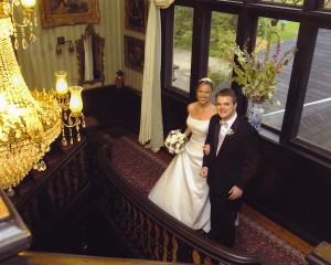 Bride and Groom Smiling for Camera on Balcony