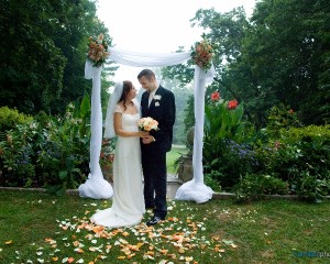 Bride and Groom Under Garden Arch Hamilton