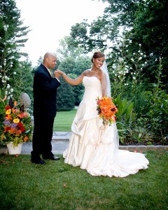 Groom Kissing Brides Hand by Garden Sachs