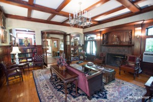 Library view with fireplace looking into the bar