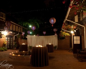 Courtyard cocktails with lanterns and screen