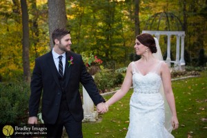 fall wedding couple by gazebo