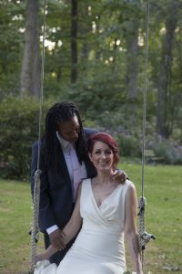 September Carriage House wedding | couple on swing | Gramercy Mansion